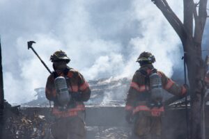 Fire-fighting men symbolizing the need of emdr therapy for first responders