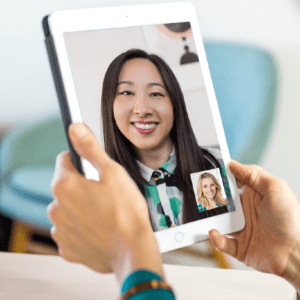 A person taking virtual therapy or telehealth through video call