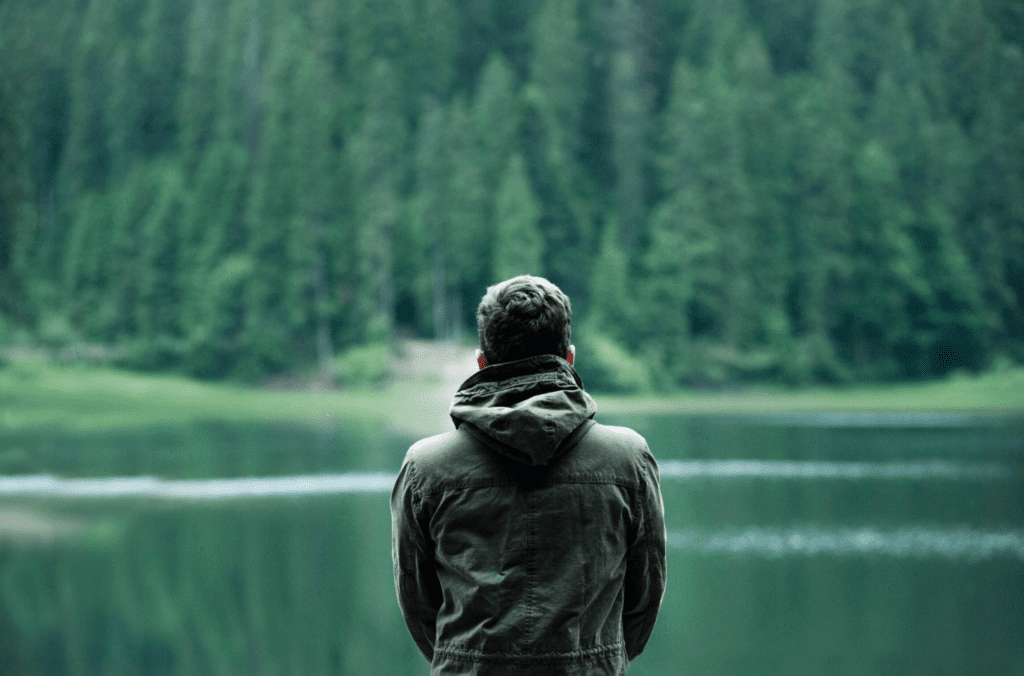 Man soaks in the calming lake view