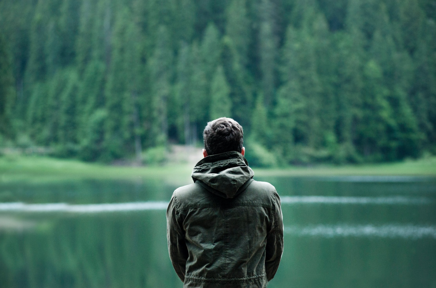 Man soaks in the calming lake view