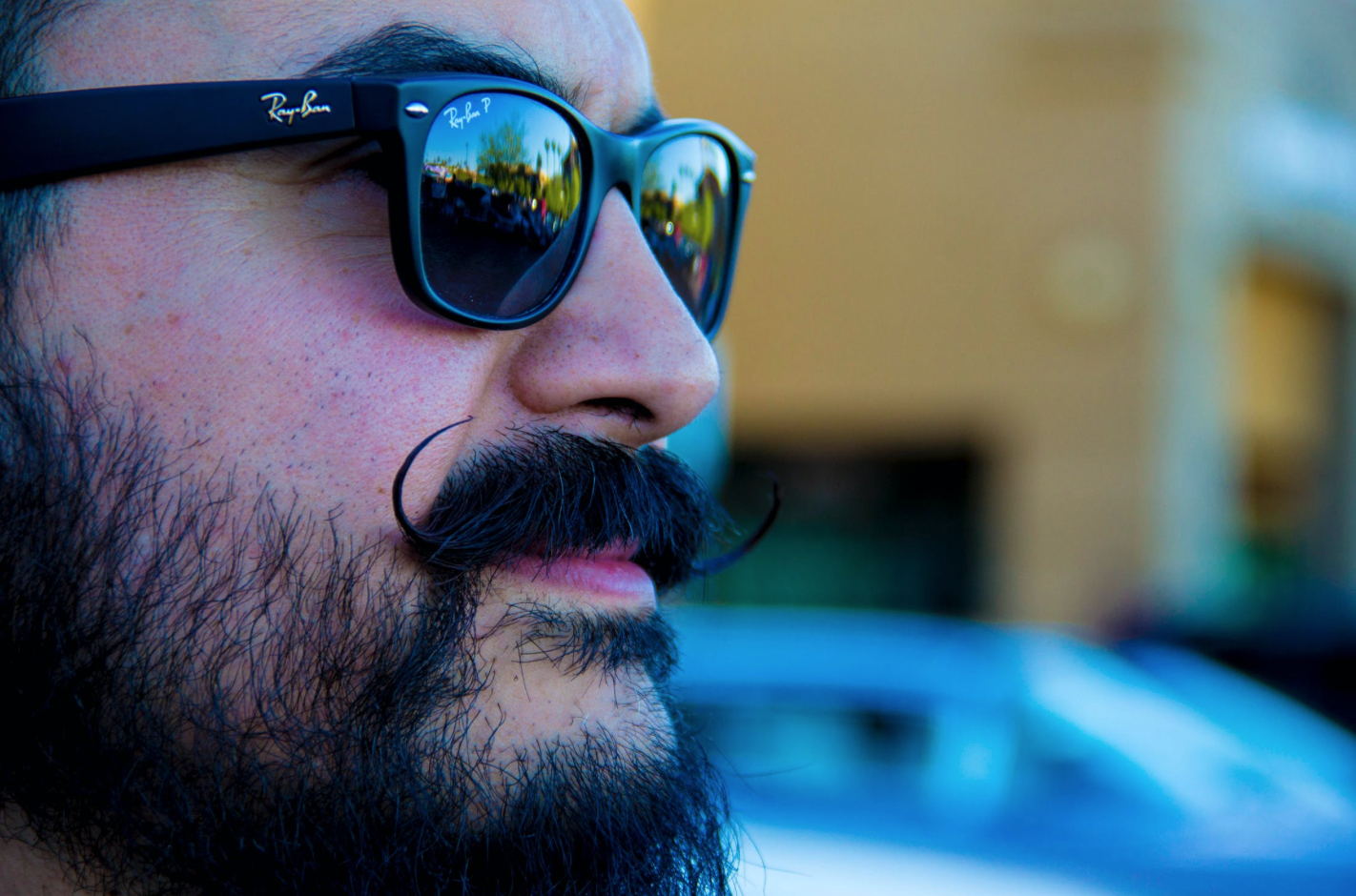 Man with mustache, symbolizing Movember and men's health awareness.