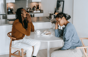 Couple in disagreement on breakfast table illustrating need for sincere communication.