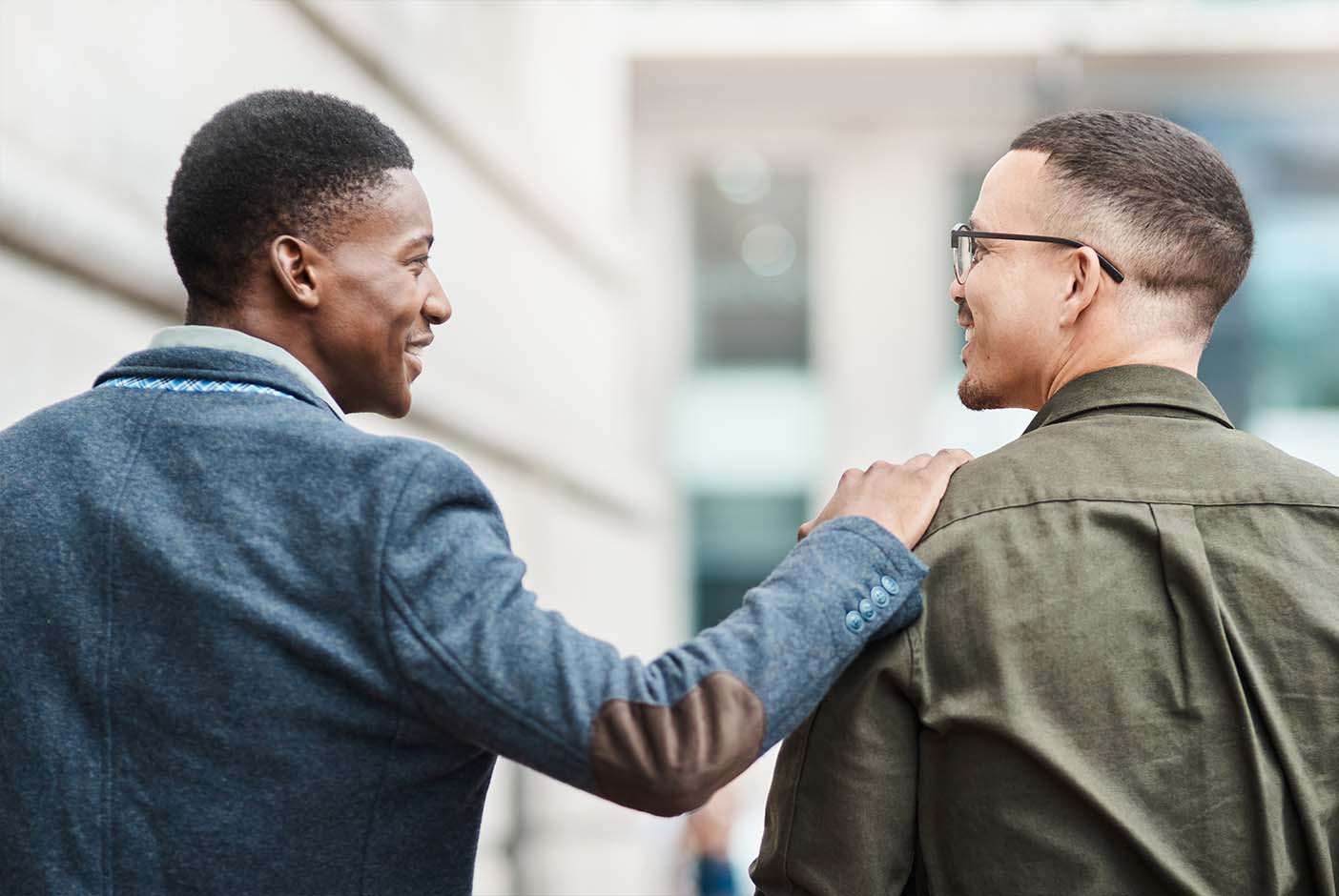 Gay couple supporting each other, illustrating therapy's role in relationships.