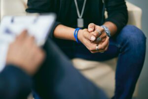 Man learning EMDR therapy benefits in session.