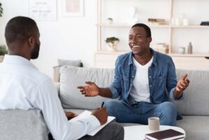 Man in therapy for ongoing mental health support.