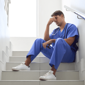 Health care worker looking stressed
