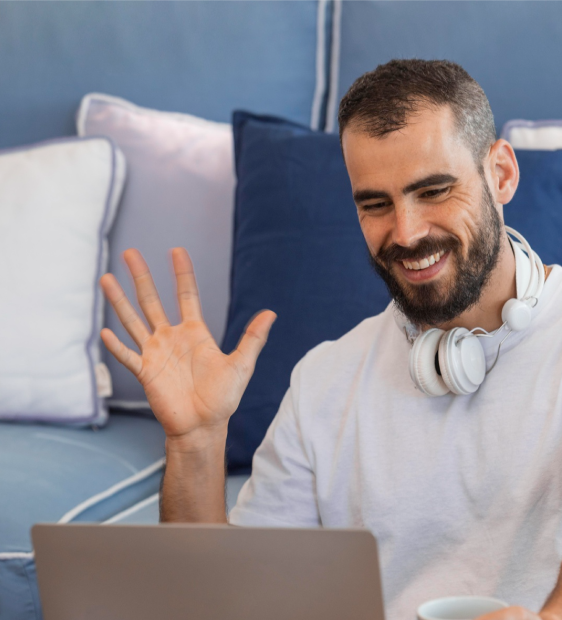 Man with headphones, smiling and experiencing virtual therapy benefits in Colorado.