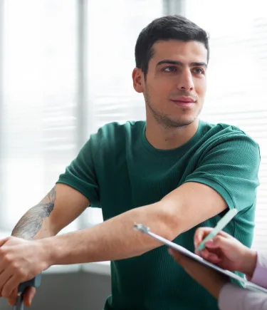 A man listening with hope during his EMDR therapy session in Denver.