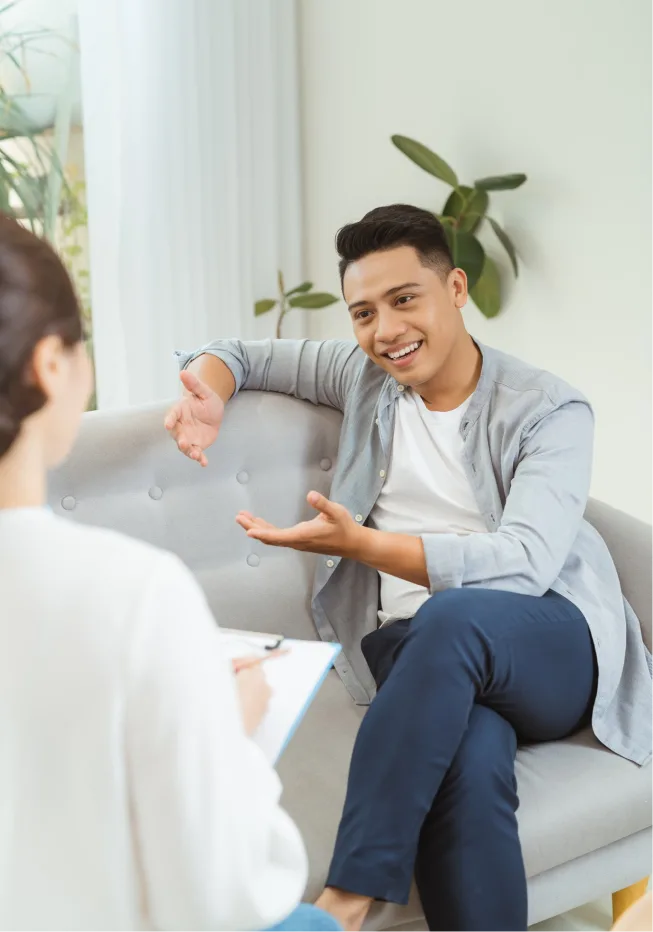 A man smiling and feeling relieved after conversing with EMDR therapist in Colorado