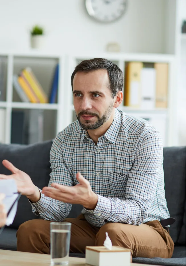 Man sharing his concerns with the therapist during a psychedelic therapy session.