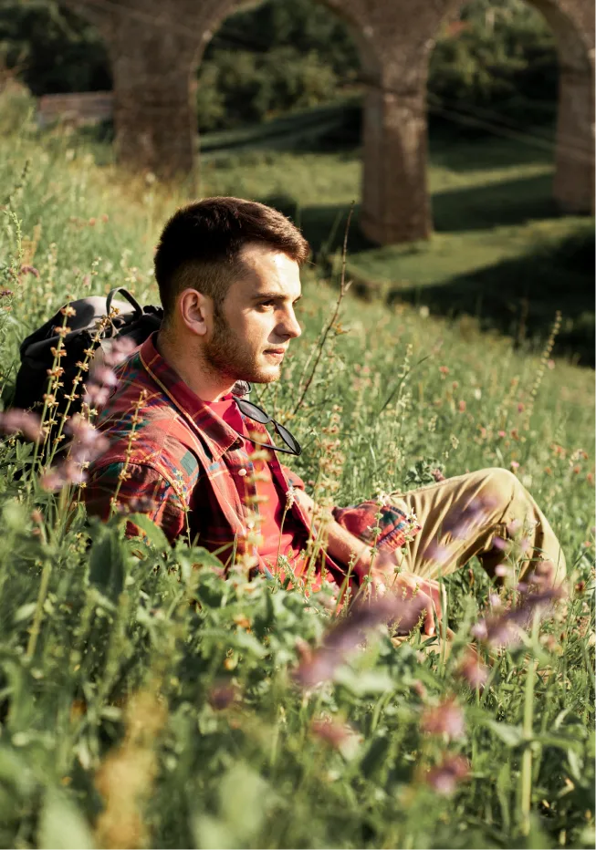 Hope after depression counseling Denver: Man looking ahead, sitting in sunlight