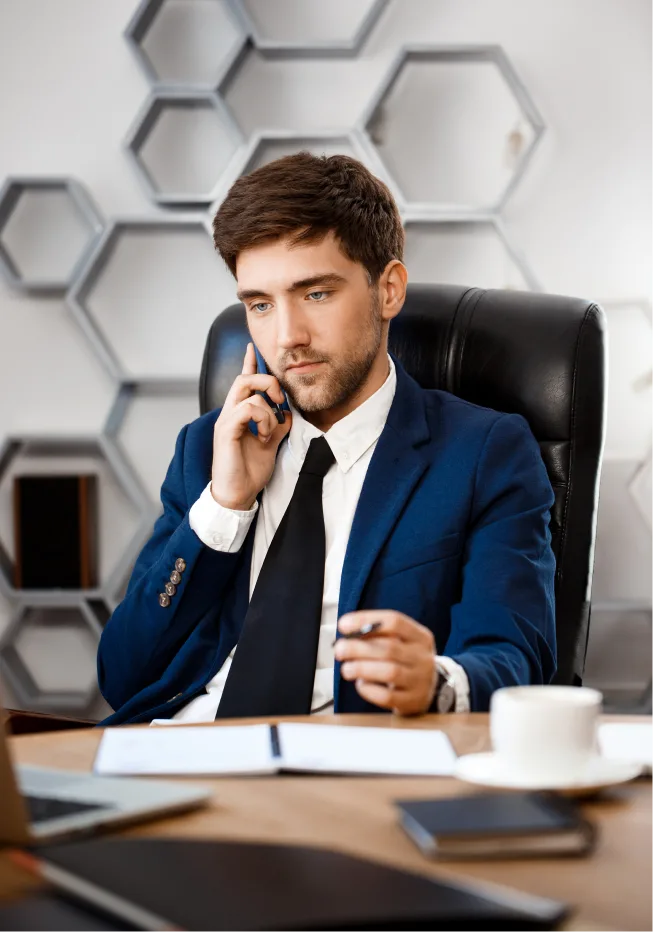 Overwhelmed businessman on phone, needing stress relief strategies in Denver