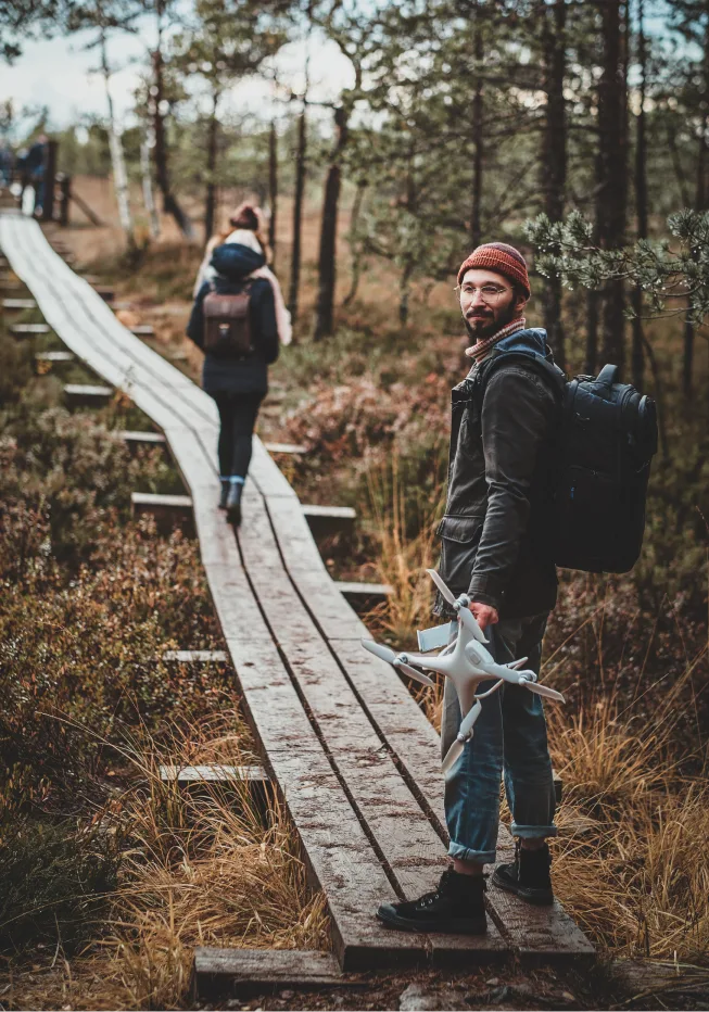 Man enjoying trekking outdoors with his partner and looks relieved. Transformative results of stress counseling Denver.