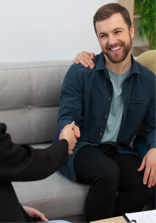 Client & therapist handshake after depression counseling session in Denver