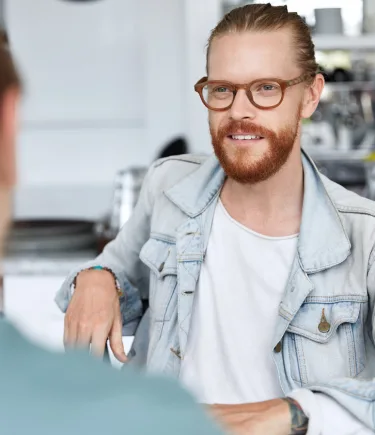 Man discussing his options for psilocybin therapy with a professional.