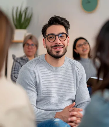 Positive outcome of depression counseling in Denver: Man sharing progress with a supportive group