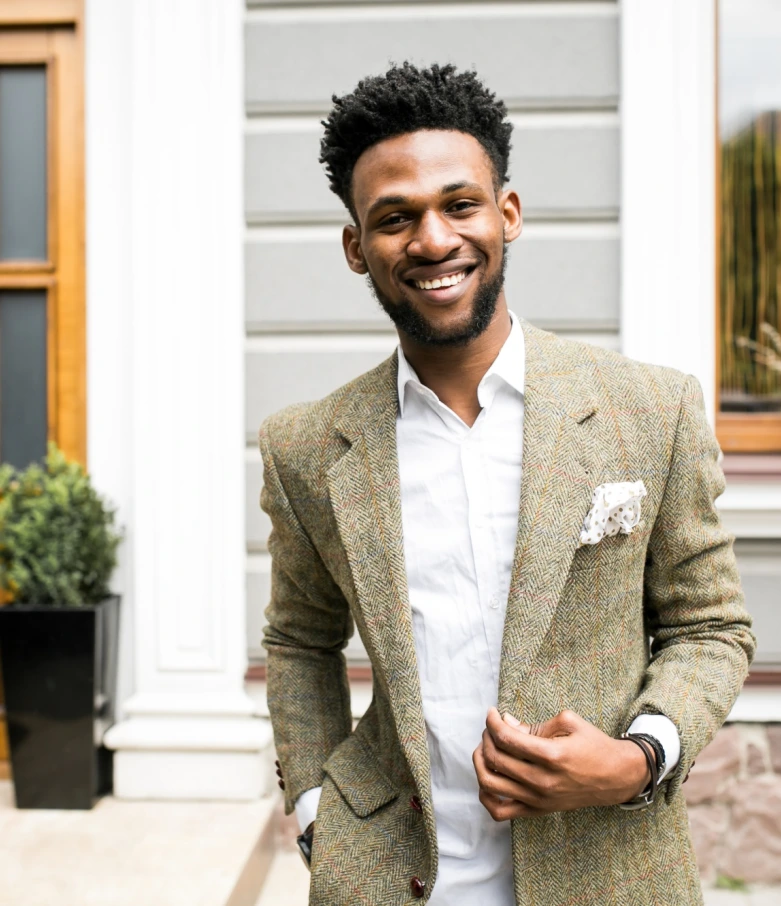 A man smiling radiantly after rediscovering self-love and acceptance through self-esteem counseling.