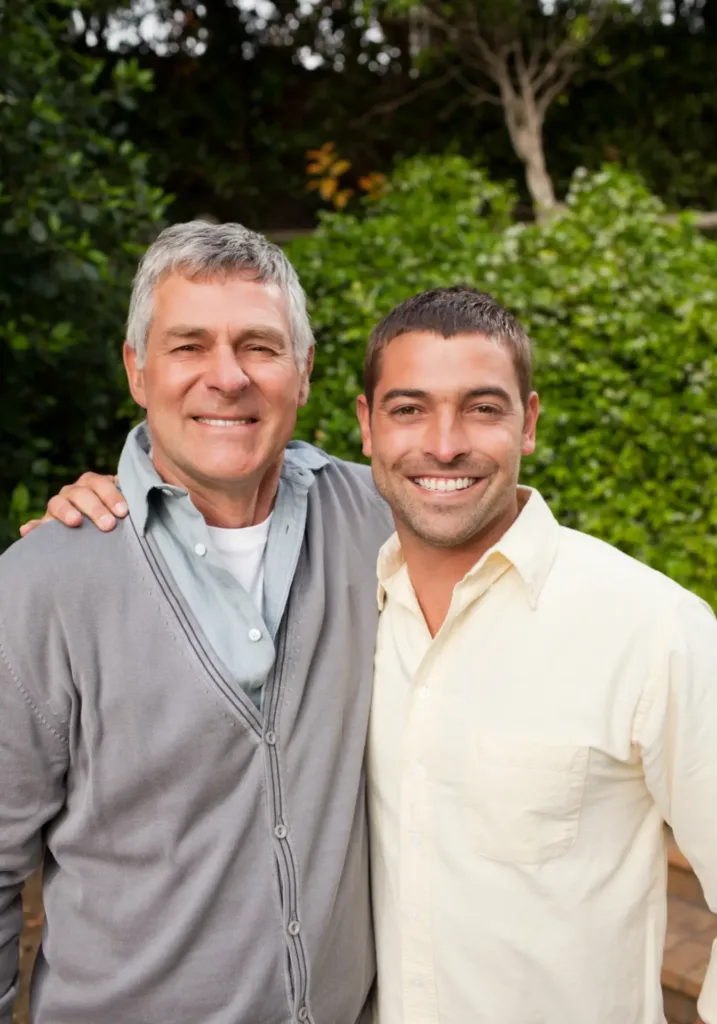 Man happily posing with his therapist after attending religious trauma counseling in Denver