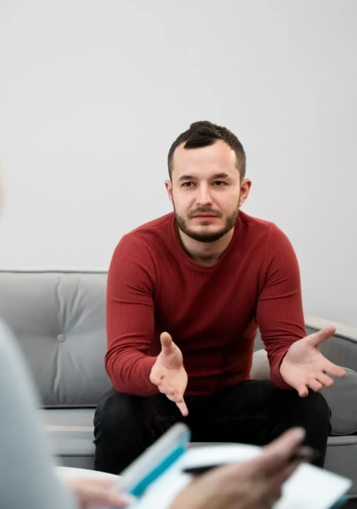 man openly sharing his concerns with a therapist during a self-esteem counseling in Denver, CO