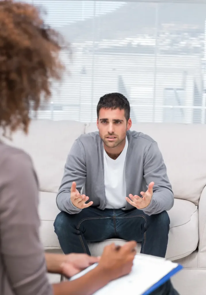 Man opens up to empathetic therapist in a supportive environment