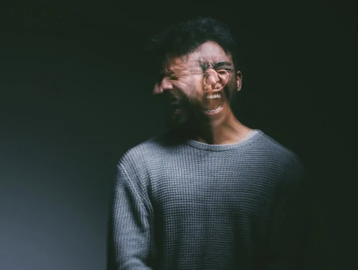 Double exposure of distressed man reflecting symptoms of post traumatic stress disorder types and emotional overload