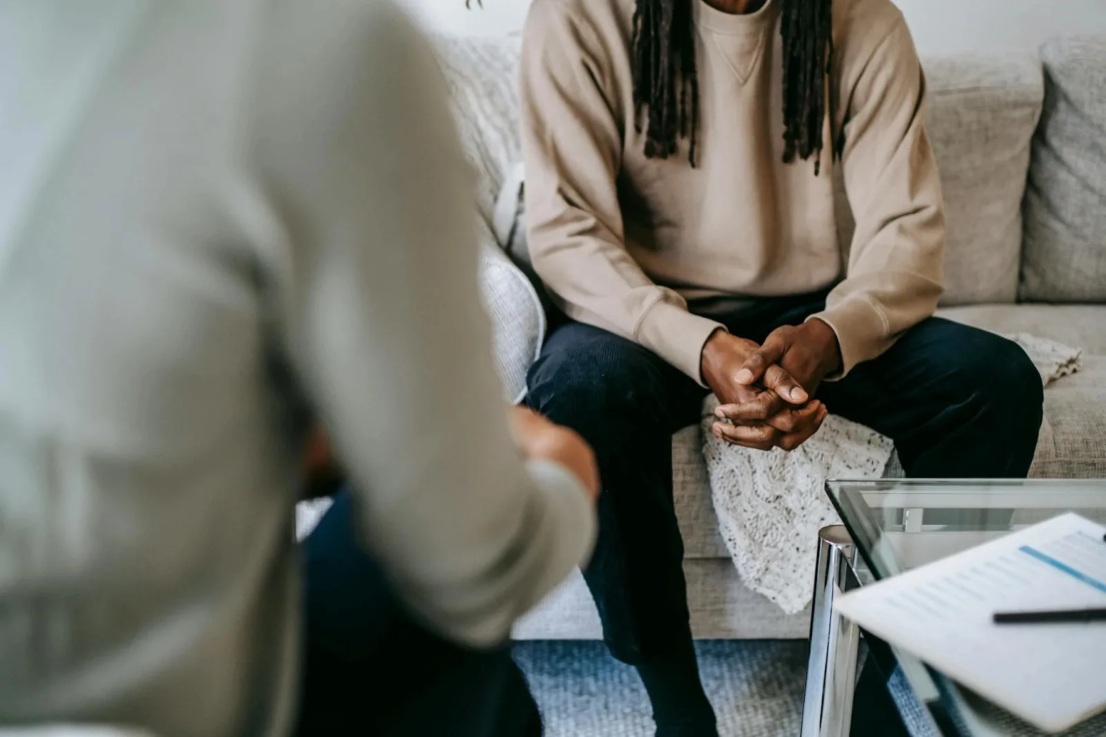 Man in therapy session receiving support for different types of PTSD and anxiety at Denver Men’s Therapy